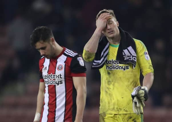 George Baldock  and Simon Moore dejected after conceding in the last minute against Cardiff City. Pic: Simon Bellis/Sportimage