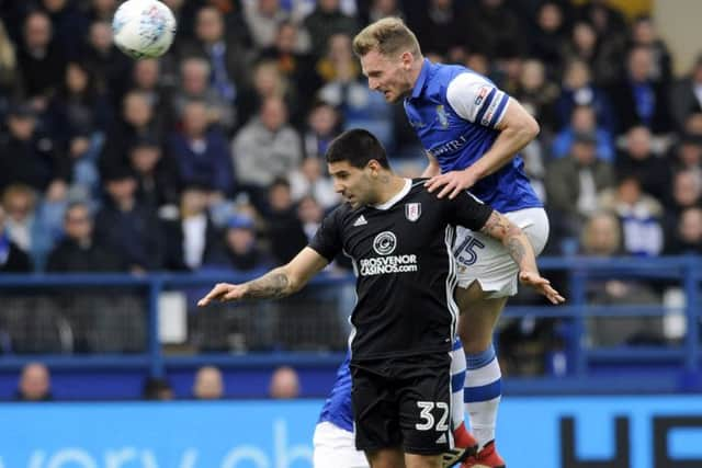 Owls skipper Tom Lees beats Fulham's Alexsander Mitrovic....Pic Steve Ellis