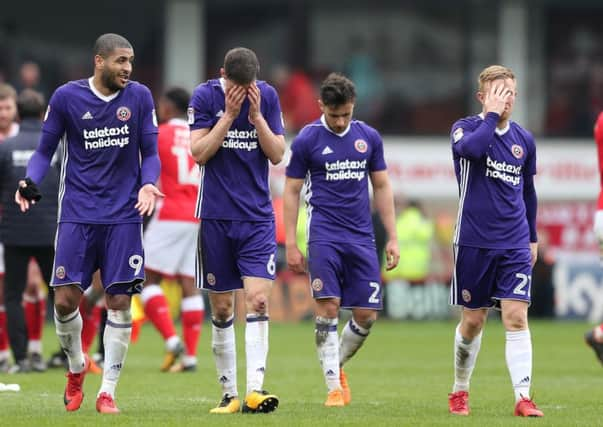 Deflated Leon Clarke, Chris Basham, George Baldock and Mark Duffy walk off at Oakwell: Simon Bellis/Sportimage