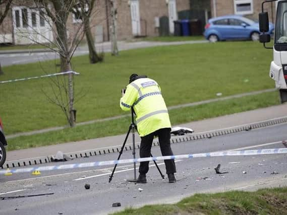 Police at the scene of the crash. Picture: Iain Ashmore.