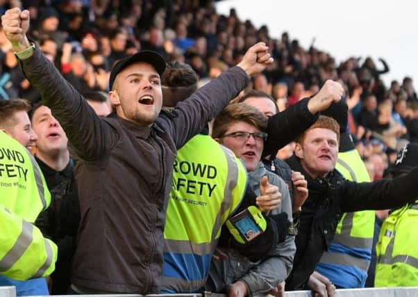 Chesterfield fans celebrate a goal.