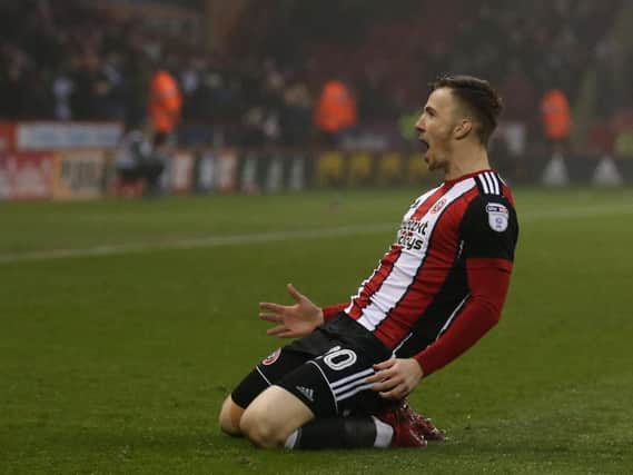 Lee Evans celebrates his first. Pictures: Simon Bellis/Sportimage