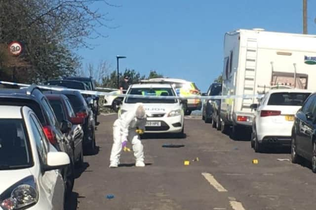 Forensic experts at work on Bransby Street, Sheffield