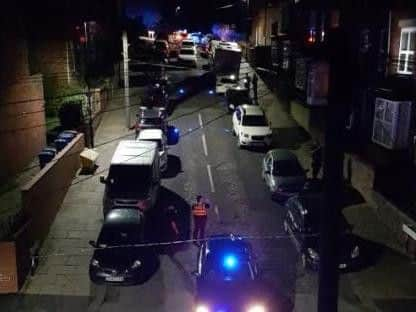 Police officers on Bransby Street, Upperthorpe, after a shooting last night