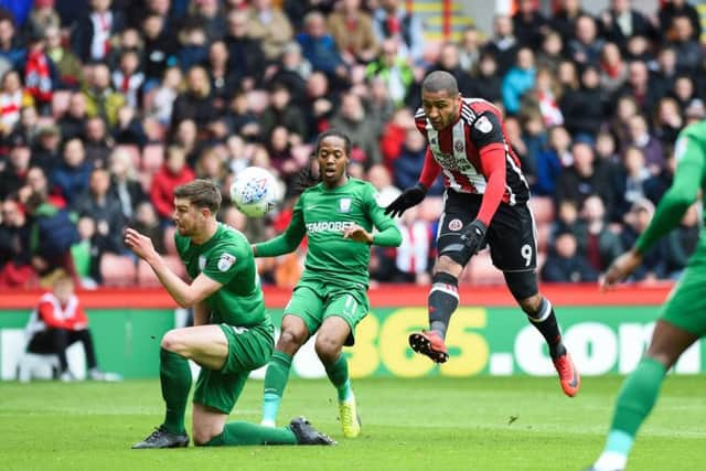 Leon Clarke shoots against Preston