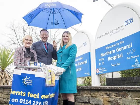 Ann Travis has been selling The Star at Northern General for 6 months and has raised 6000 for the Sheffield Hospitals Charity. Ann is with David Reynolds, executive Director and Nancy Fielder Editor of The Star.