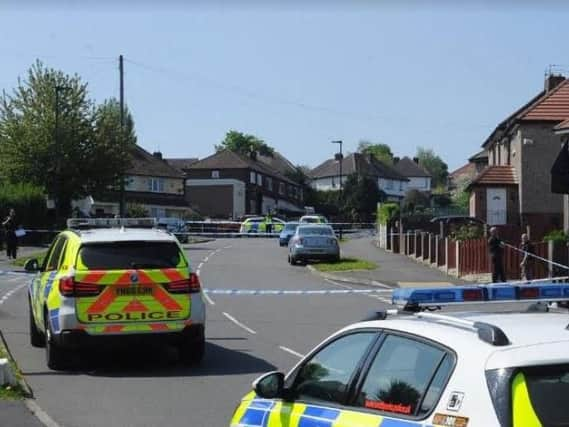 Police officers on Chadwick Road after a shooting earlier today