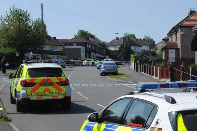 Police officers on Chadwick Road after a shooting earlier today