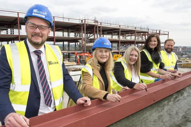 Coun Jackie Drayton signs the steels with Principal Kim Walton