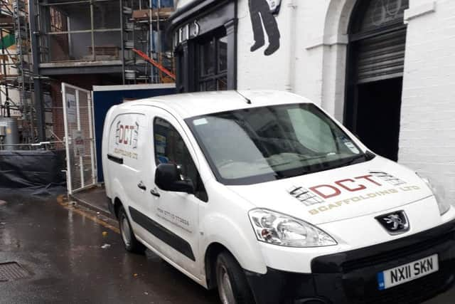 Construction van blocking the front door of the restaurant/bar