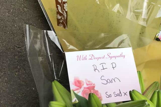 People have begun to leave floral tributes to murder victim, Sam Baker