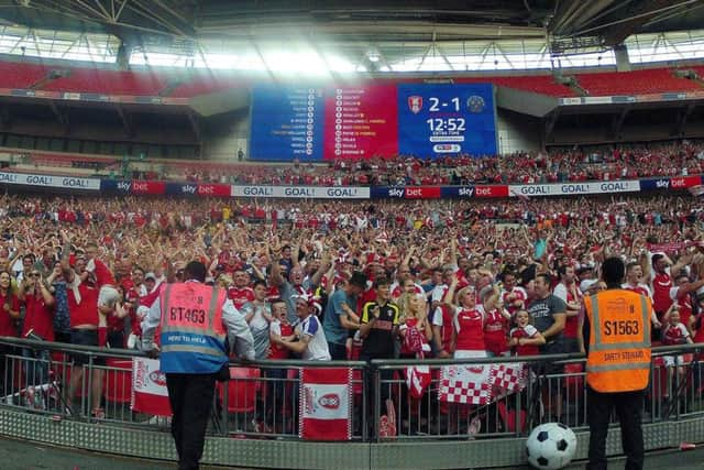 Rotherham United fans celebrating at the final whistle