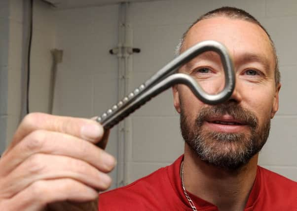 Martin Roberts, of Titan Climbing, with a titanium rock bolt.